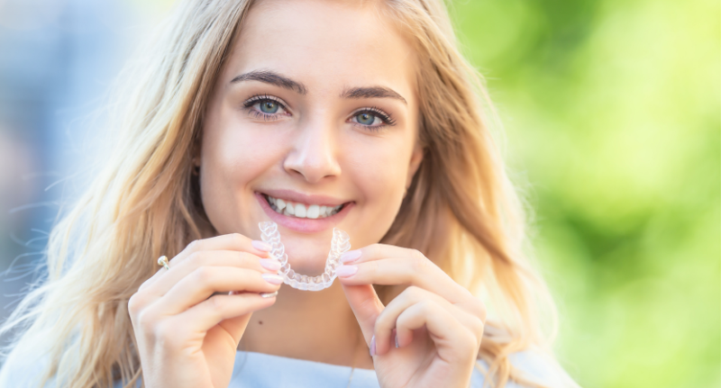 teen with Invisalign aligners 